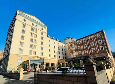 a building on a street in front of a building at Glasgow Argyle Hotel, BW Signature Collection in Glasgow