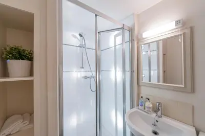 a bathroom with a shower and a sink at Apartment Jamaica Street 7 in Edinburgh