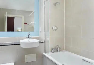 a bathroom with a sink and a shower at Leonardo Edinburgh City in Edinburgh