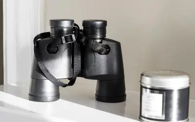 a pair of binoculars sitting on top of a shelf at Glenegedale House in Kintra