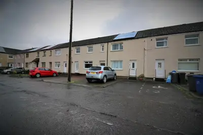 a car parked in a parking lot in front of buildings at Signature - Atholl House Glasgow Airport in Paisley