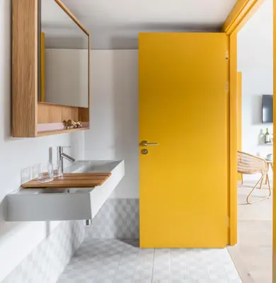 a yellow door in a kitchen with a sink at Eden Locke in Edinburgh