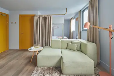 a living room with a couch and a table at Eden Locke in Edinburgh