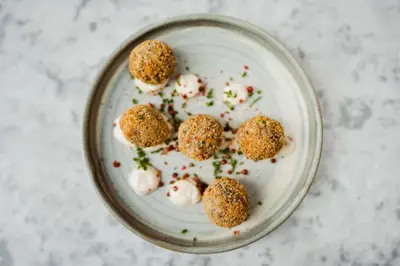a plate of food with dumplings on a table at Radisson Blu Hotel, Glasgow in Glasgow