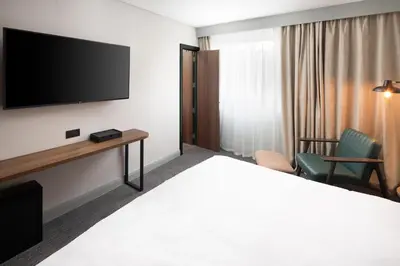 a hotel room with a bed and a tv at Four Points by Sheraton Edinburgh in Edinburgh
