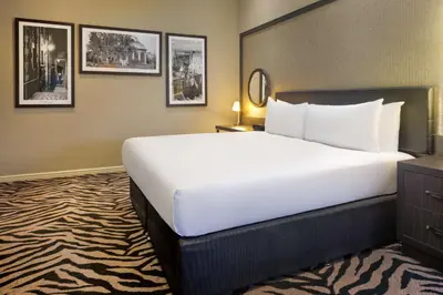 a large white bed in a hotel room at Doubletree by Hilton Edinburgh City Centre in Edinburgh