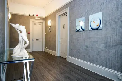 a room with a sculpture on a wall at City Apartments in Glasgow
