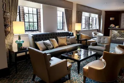 a living room with a couch and chairs at Western House Hotel At Ayr Racecourse in Ayr