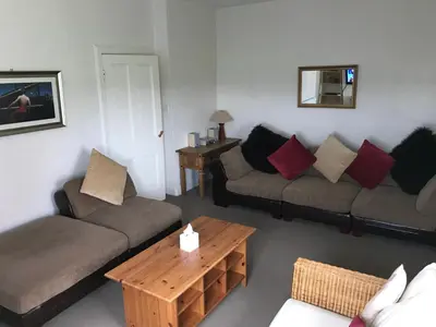 a living room with two couches and a coffee table at Ayrshire cottage in Kilmarnock