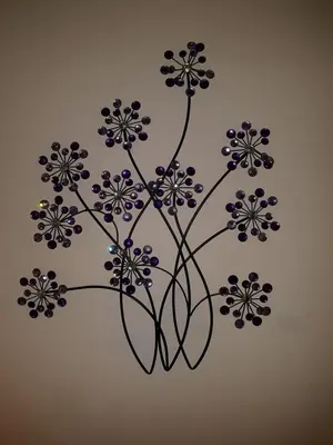 a painting of a vase with flowers on a wall at Livingston 4 bedroom townhouse in Livingston