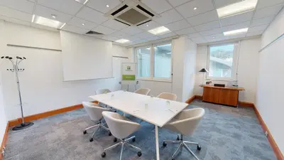 a meeting room with a white table and chairs at Holiday Inn Edinburgh Zoo by IHG in Edinburgh