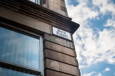 a street sign on the side of a building at Apex City of Glasgow Hotel in Glasgow