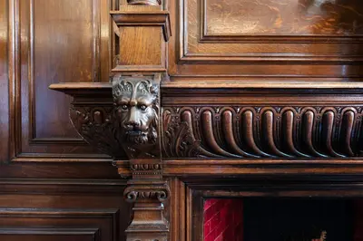a wooden door with a face carved into it at Grosvenor Suites in Edinburgh