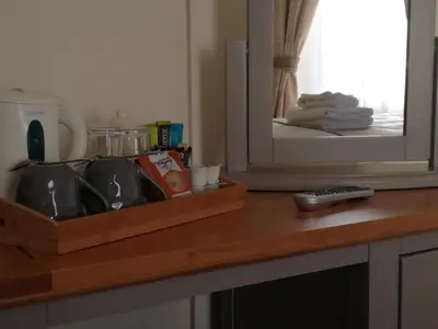 a kitchen counter with a sink in front of a mirror at Lubnaig Guest House in Callander