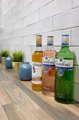 three bottles of alcohol sitting on a table at The County Hotel in Helensburgh