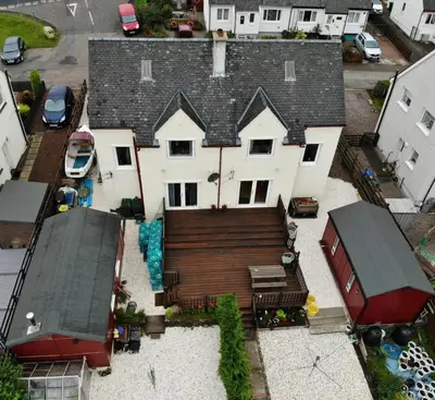 an aerial view of a house with a roof at Maggie's in Inveraray