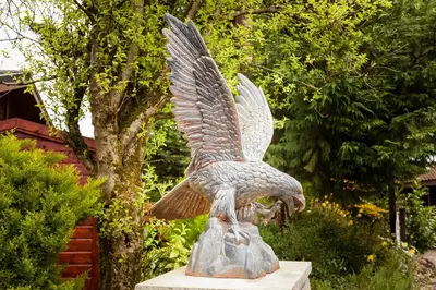 a statue of a bird with its wings spread at Thistle Lodge in Auchterarder