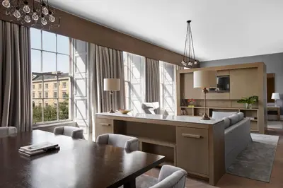 a kitchen and dining room with a table and chairs at Kimpton Blythswood Square Hotel & Spa by IHG in Glasgow
