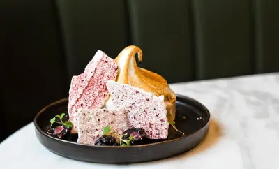 a plate with three different colored desserts on a table at Kimpton Blythswood Square Hotel & Spa by IHG in Glasgow