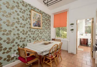 a dining room with a table and chairs at The Lauderdale Street Residence in Edinburgh