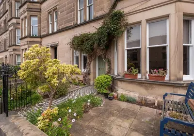 a house with a garden in front of it at The Lauderdale Street Residence in Edinburgh