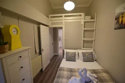a small bedroom with a bed and a bunk bed at Slateford House Apartment Ground Floor Main Door in Edinburgh