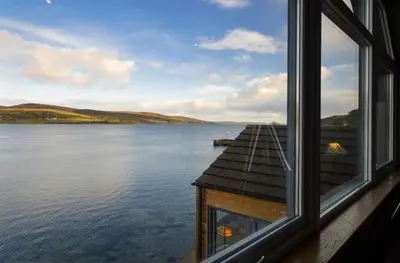 a window with a view of a body of water at Taigh na Mara in Kames