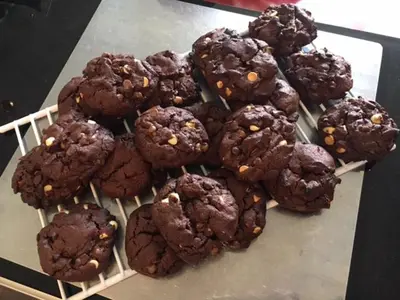 a pile of chocolate cookies on a cooling rack at Rosebank House Bed & Breakfast in Strathyre