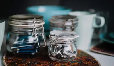 a group of glass jars sitting on a table at Cunninghame 1 in Beith