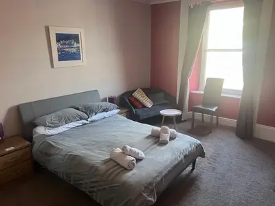 a bedroom with a bed with stuffed animals on it at The waterfront in Tarbert