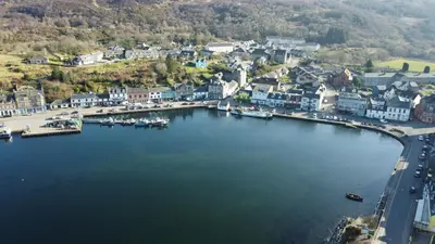an aerial view of a small town next to a body of water at The waterfront in Tarbert