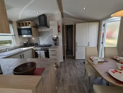 a kitchen with a table and a counter top at The Manor Sea View 8 in Dunoon