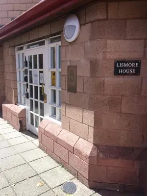 a brick building with a entrance to a house at 1/5 Lismore House in Oban