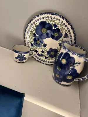 a blue and white vase and a plate on a shelf at Georgian House in Edinburgh