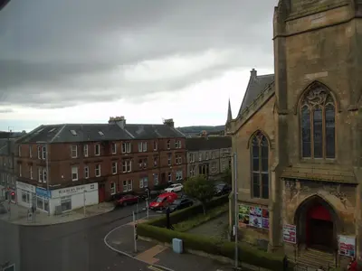 a view of a church and a street with buildings at Snug - Krayr Apartment in Helensburgh
