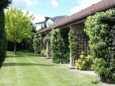 a house with ivy on the side of it at Castlecary House Hotel in Cumbernauld
