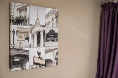 a picture hanging on a wall with photographs of monuments at The Titan By Greene King Inns in Clydebank