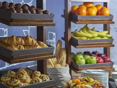a display of different types of bread and fruit at ibis budget Glasgow in Glasgow