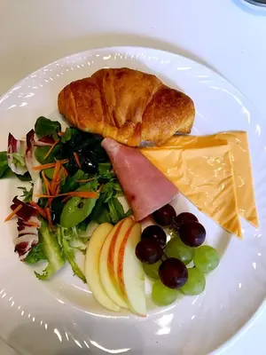 a plate of food with a salad and bread and fruit at Acer Lodge Guest House in Edinburgh