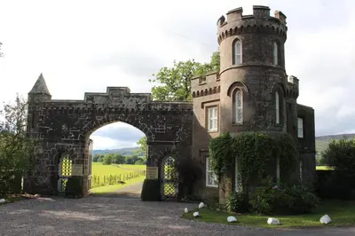 an entrance to a castle with an archway at East Lodge in Crieff