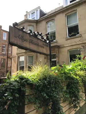 a sign in front of a building at Albyn Townhouse in Edinburgh