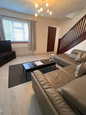 a living room with a couch and a coffee table at Kelpies Serviced Apartments- Russell in Falkirk