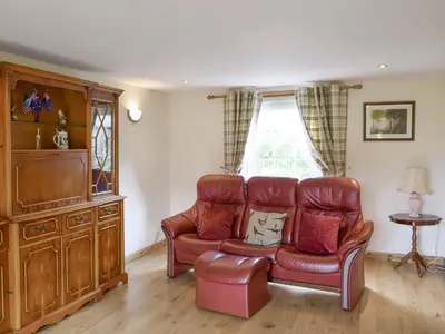 a living room with a couch and a chair at The Ploughmans - Uk5531 in Kepculloch