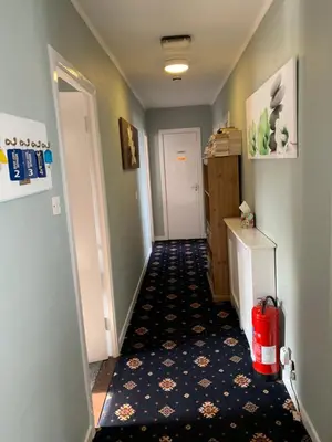 a hallway with a room with a door and a hallwayngth at Greenacre in Oban