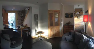 a living room with two couches and a table at Ayrshire Holiday Cottage in Girvan