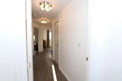 a hallway of a home with white walls and a ceiling at Dunfermline - Luxury Two Bedroom Apartment - TP in Dunfermline