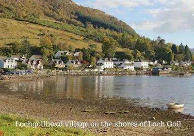 a village on the shore of a body of water at Armadale Cottage in Lochgoilhead