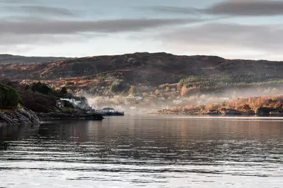 a large body of water with mountains in the background at Knap Guest House in Tarbert