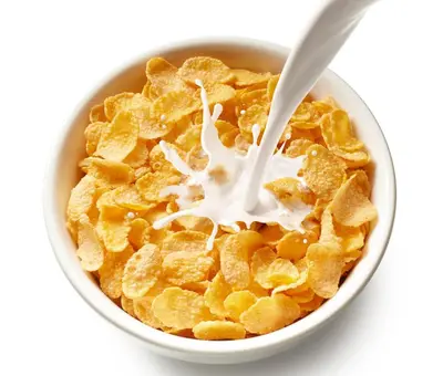 a bowl of cereal with milk and corn flakes at Knap Guest House in Tarbert