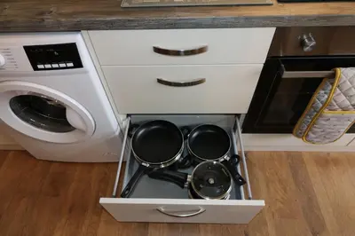 a drawer in a kitchen with pots and pans at Blairmains Guest House in Kirk of Shotts